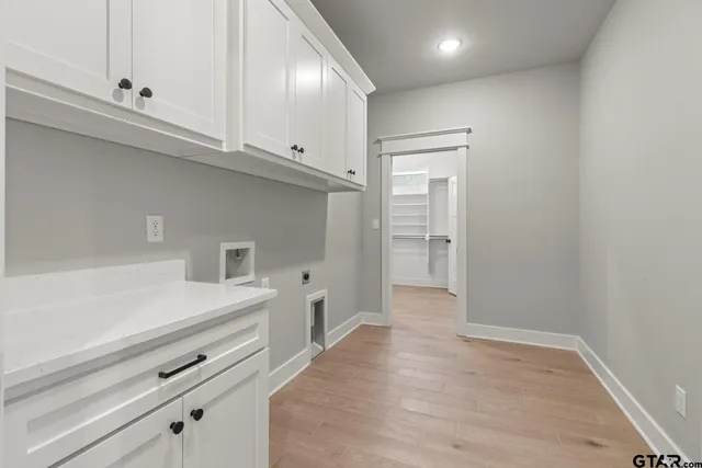 a view of a kitchen with electric appliances