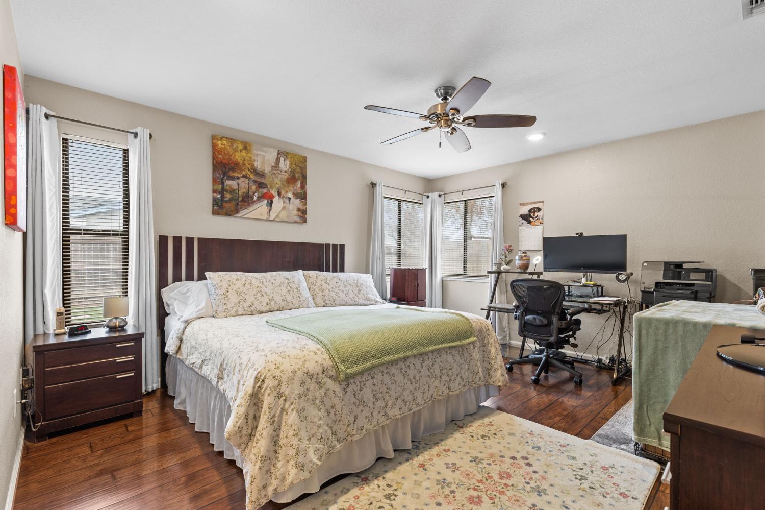 675 Young Way Roseville, CA 95678 - Photo 18 of 35 a bedroom with a bed and wooden floor