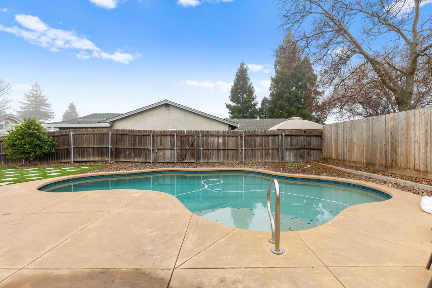 675 Young Way Roseville, CA 95678 - Photo 30 of 35 a view of a house with swimming pool and a yard
