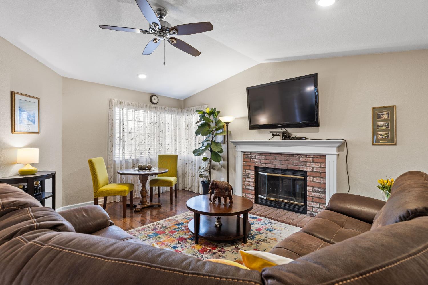 675 Young Way Roseville, CA 95678 - Photo 5 of 35 a living room with furniture a fireplace and a flat screen tv