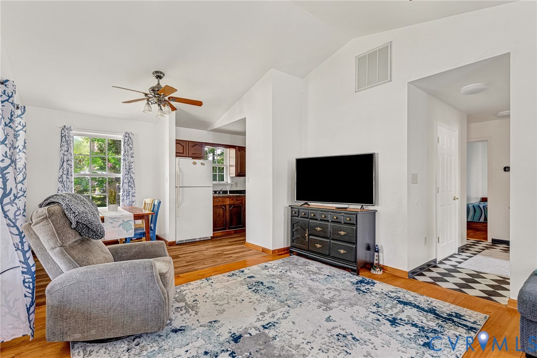 Bright living room featuring hardwood flooring, a