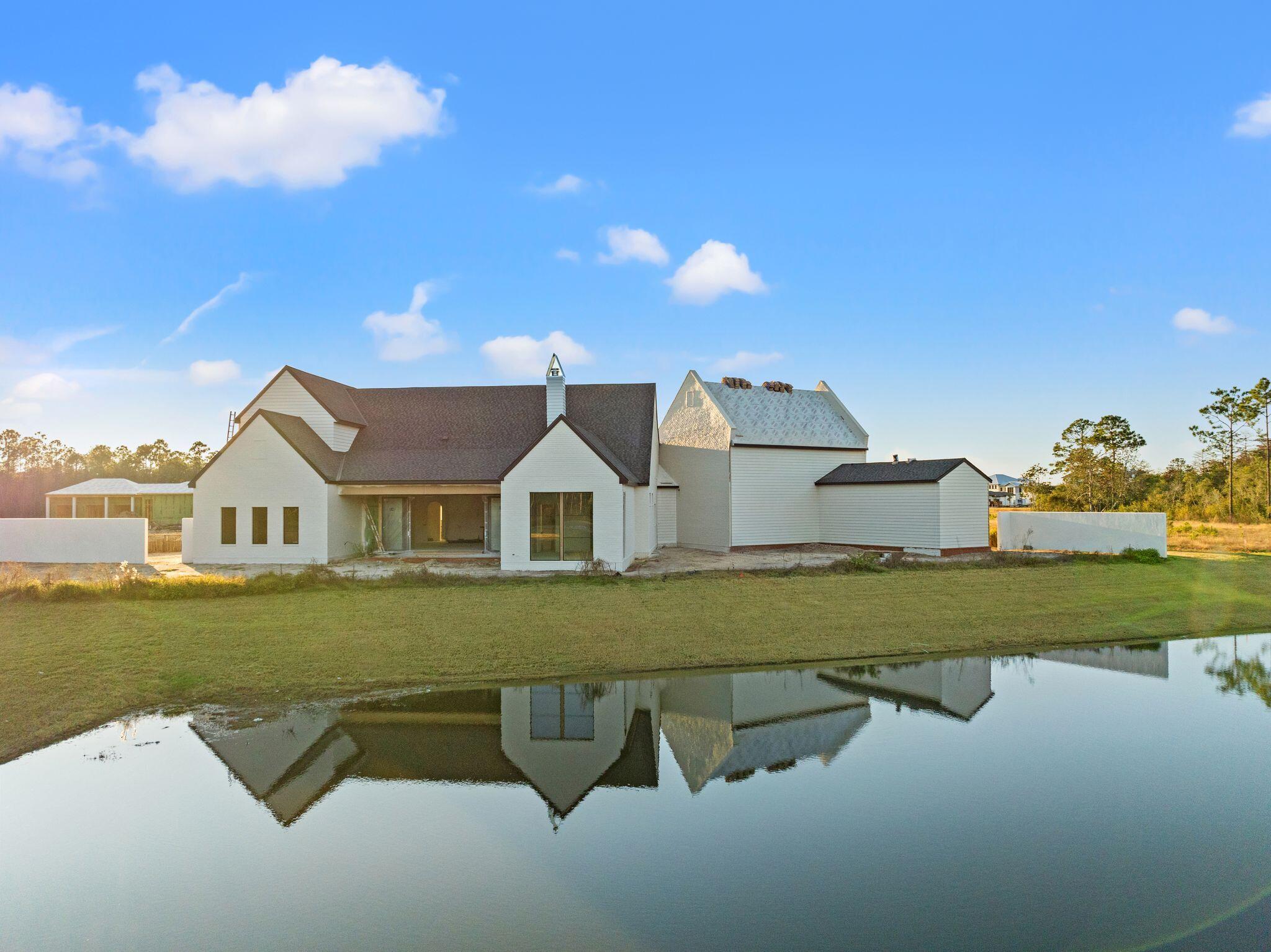 106 South Southern Cross Ln Inlet Beach Inlet Beach, FL 32461 - Photo 15 of 29 a front view of a house with garden