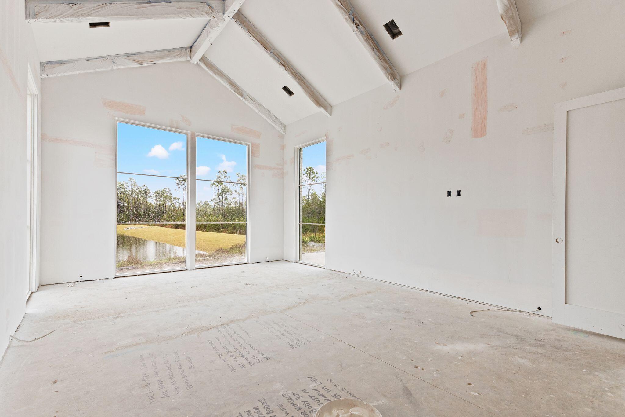 106 South Southern Cross Ln Inlet Beach Inlet Beach, FL 32461 - Photo 17 of 31 a view of an empty room with glass door