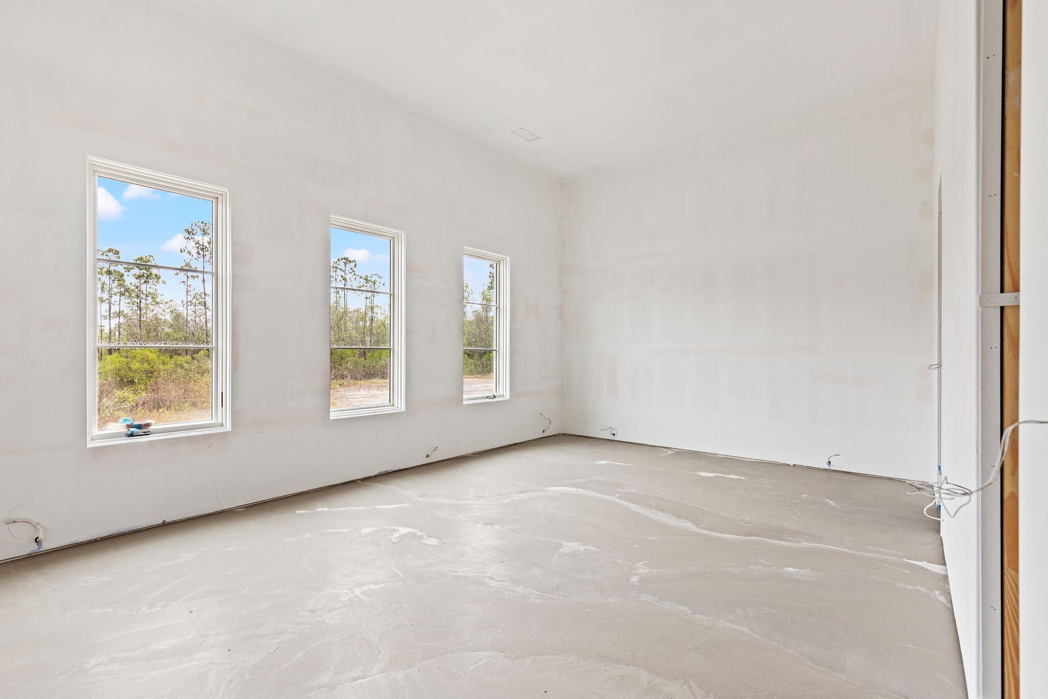 106 South Southern Cross Ln Inlet Beach Inlet Beach, FL 32461 - Photo 19 of 31 an empty room with windows