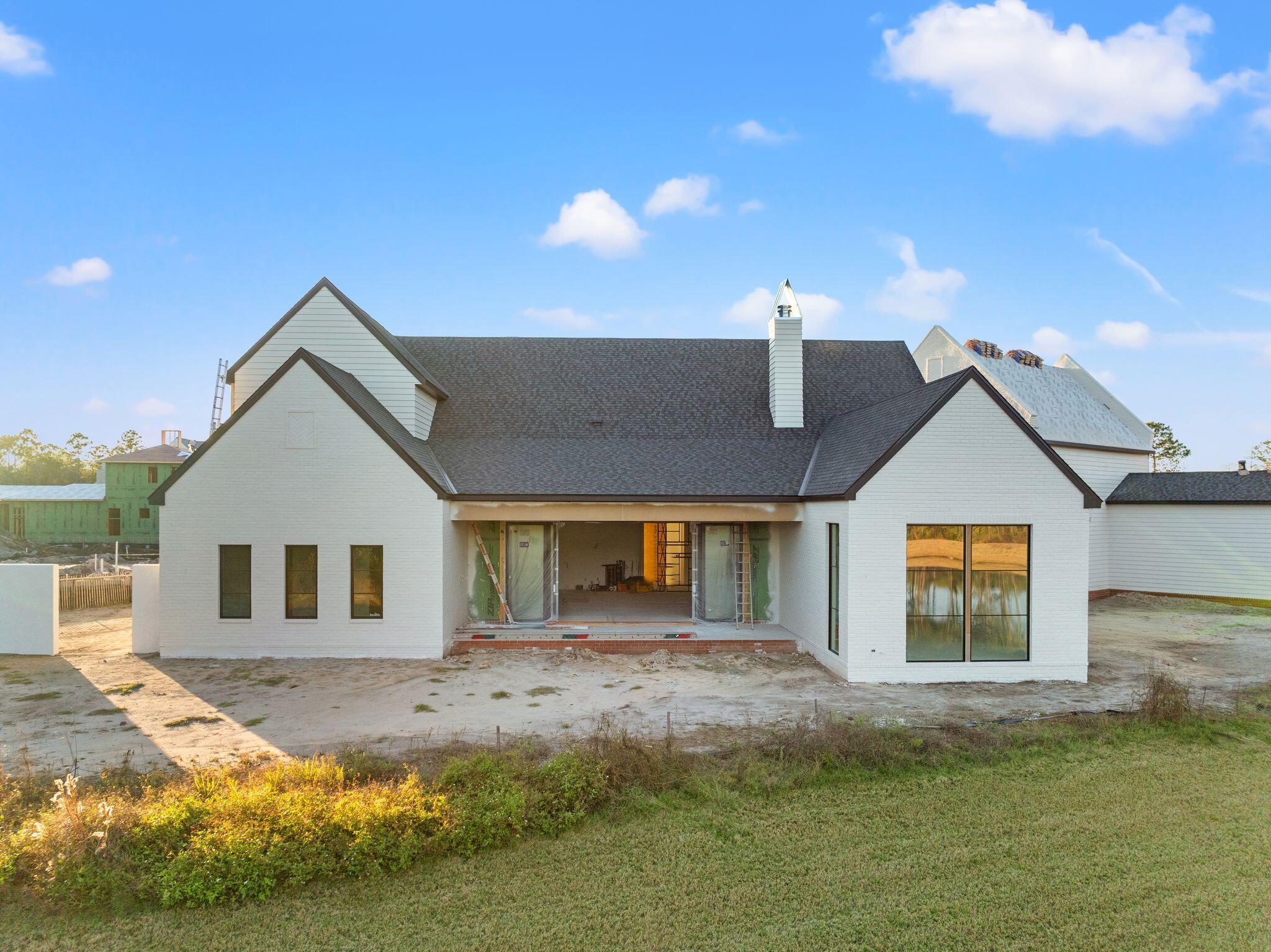 106 South Southern Cross Ln Inlet Beach Inlet Beach, FL 32461 - Photo 4 of 31 a front view of a house with a yard