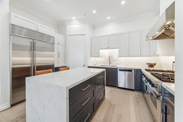 a kitchen with a stove and a refrigerator