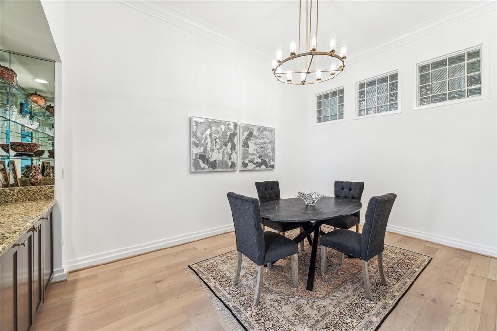 3388 Sage Road, Unit 2001 Houston, TX 77056 - Photo 7 of 25 a view of a dining room with furniture and chandelier