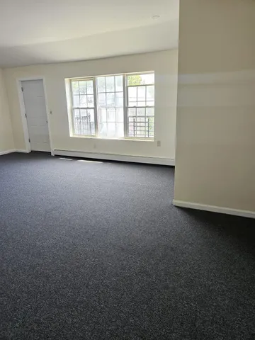 a kitchen with granite countertop a refrigerator stove and sink