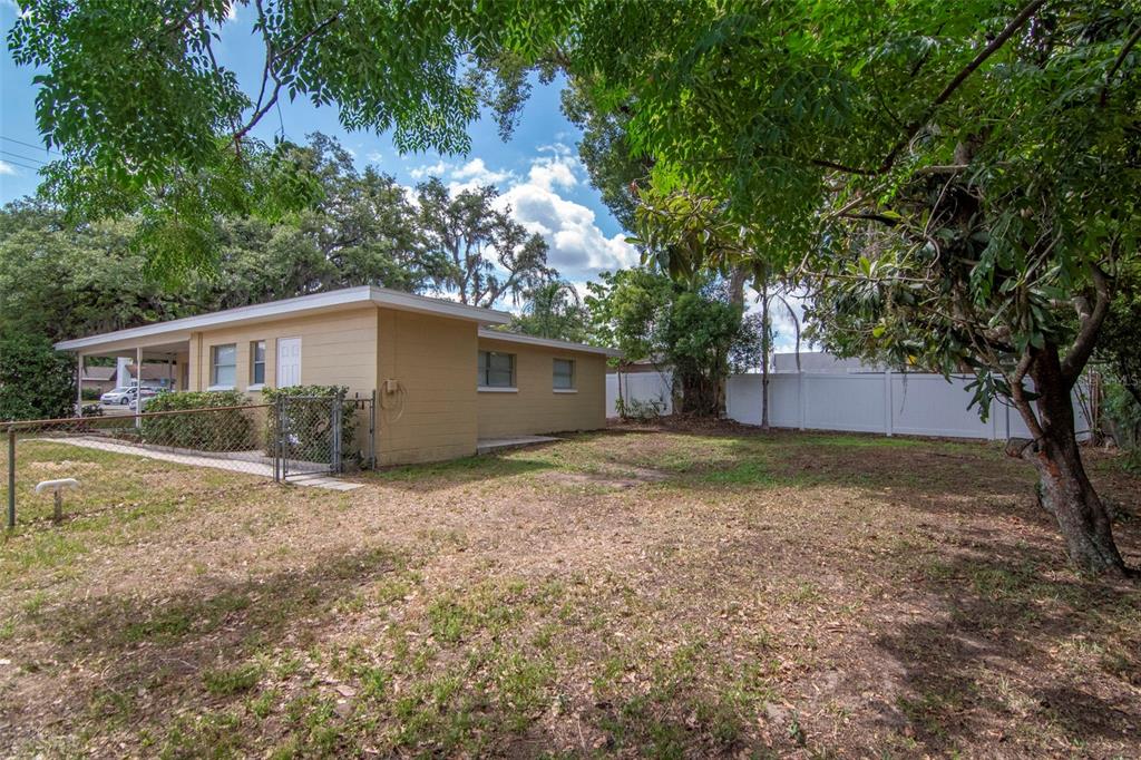 126 Kingsway Road Brandon, FL 33510 - Photo 7 of 42 a view of a house with a yard