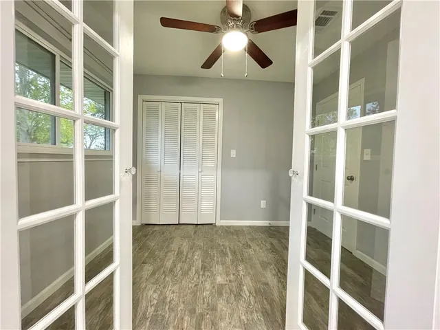 a view of an empty room with a window