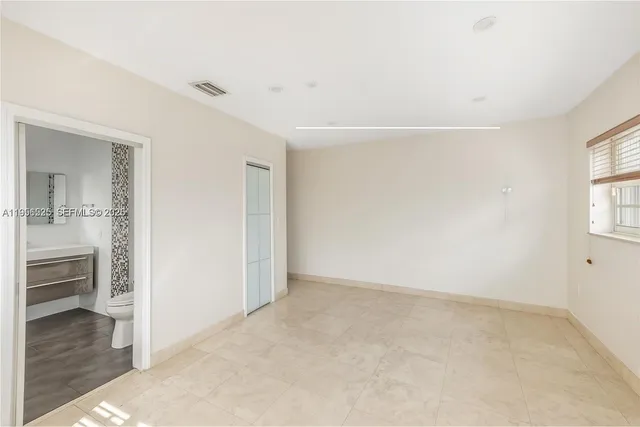 a large kitchen with a window