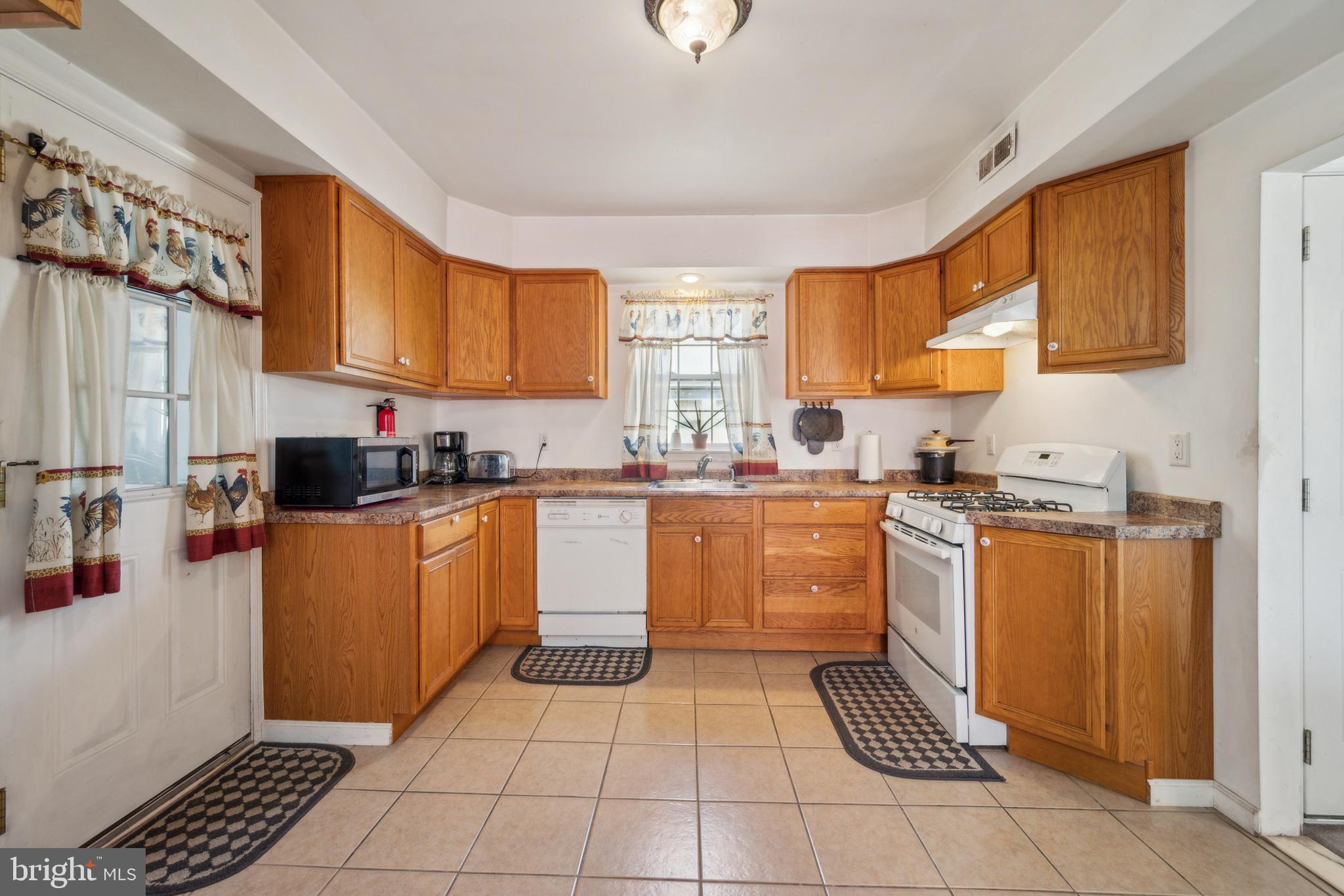 19 Stewart Avenue Delran, NJ 08075 - Photo 11 of 25 a kitchen with stainless steel appliances granite countertop a stove top oven a sink a counter space and cabinets