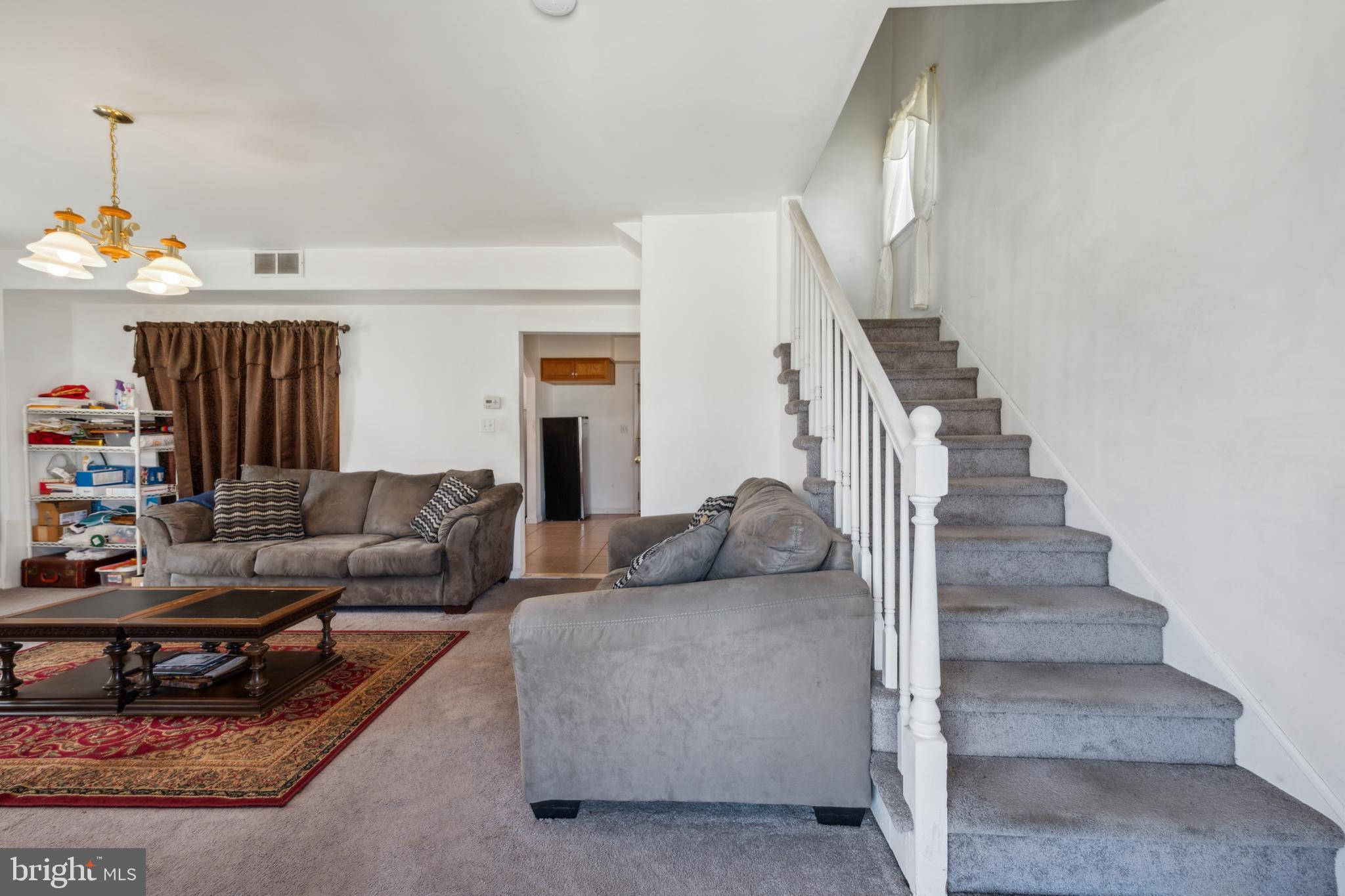19 Stewart Avenue Delran, NJ 08075 - Photo 5 of 25 a living room with furniture and stairs