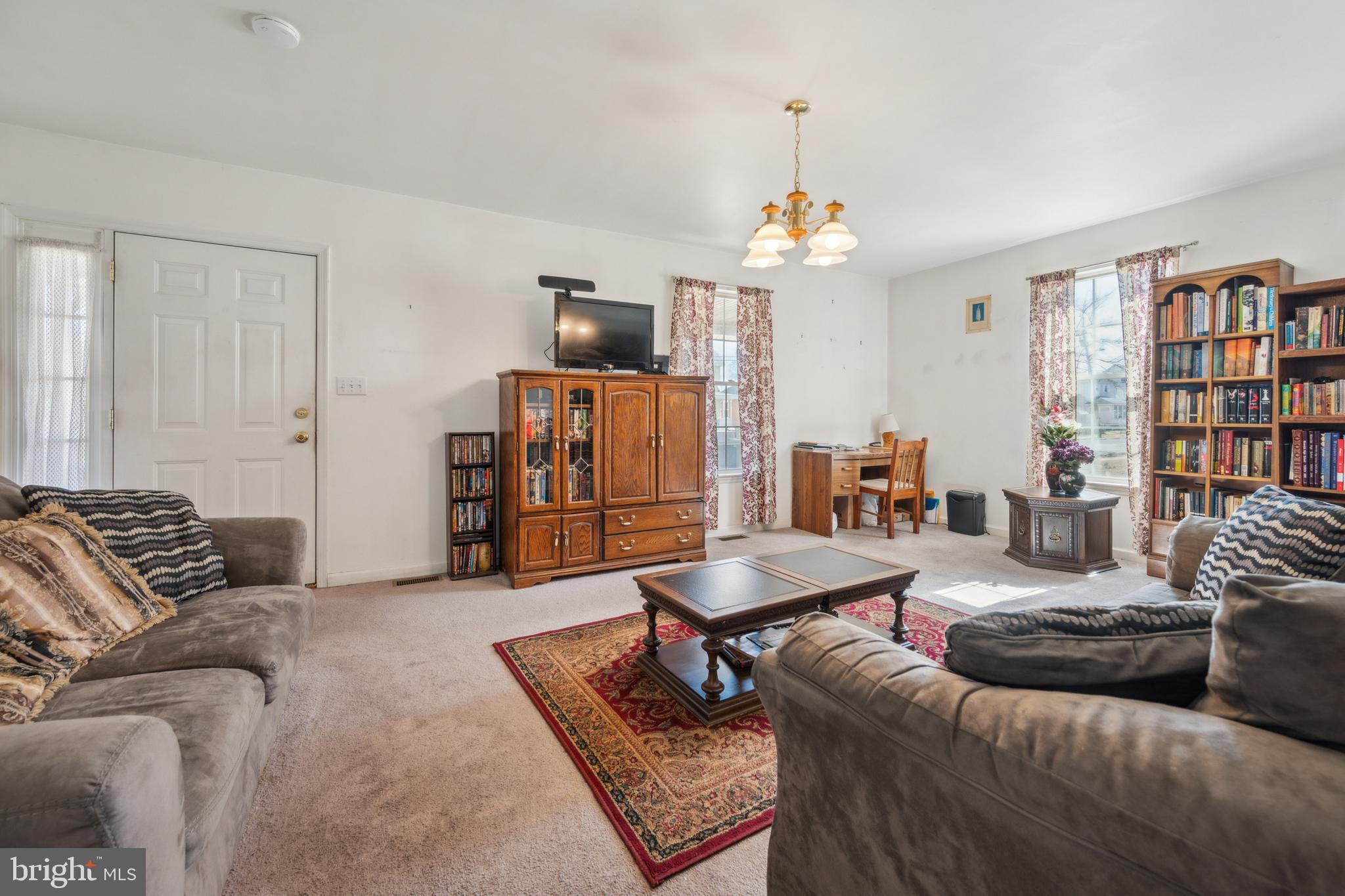 19 Stewart Avenue Delran, NJ 08075 - Photo 7 of 25 a living room with furniture and a flat screen tv