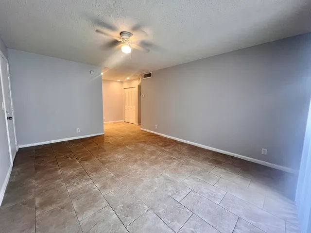 a bathroom with a toilet sink double vanity and mirror