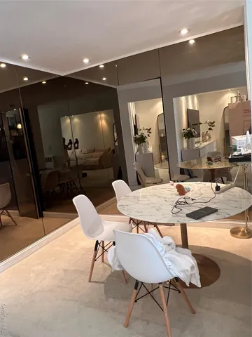 a view of a a dining room with furniture