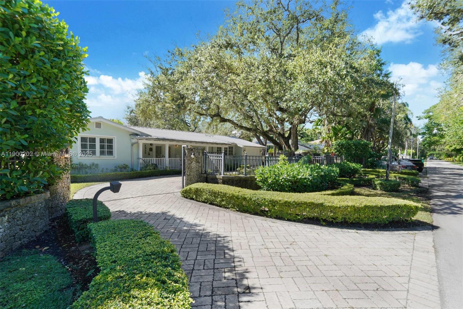 4920 Southwest 76th Street Miami, FL 33143 - Photo 1 of 36 a front view of a house with a yard