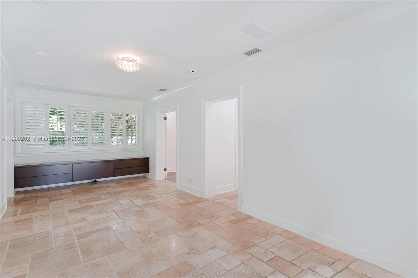 4920 Southwest 76th Street Miami, FL 33143 - Photo 19 of 36 an empty room with windows