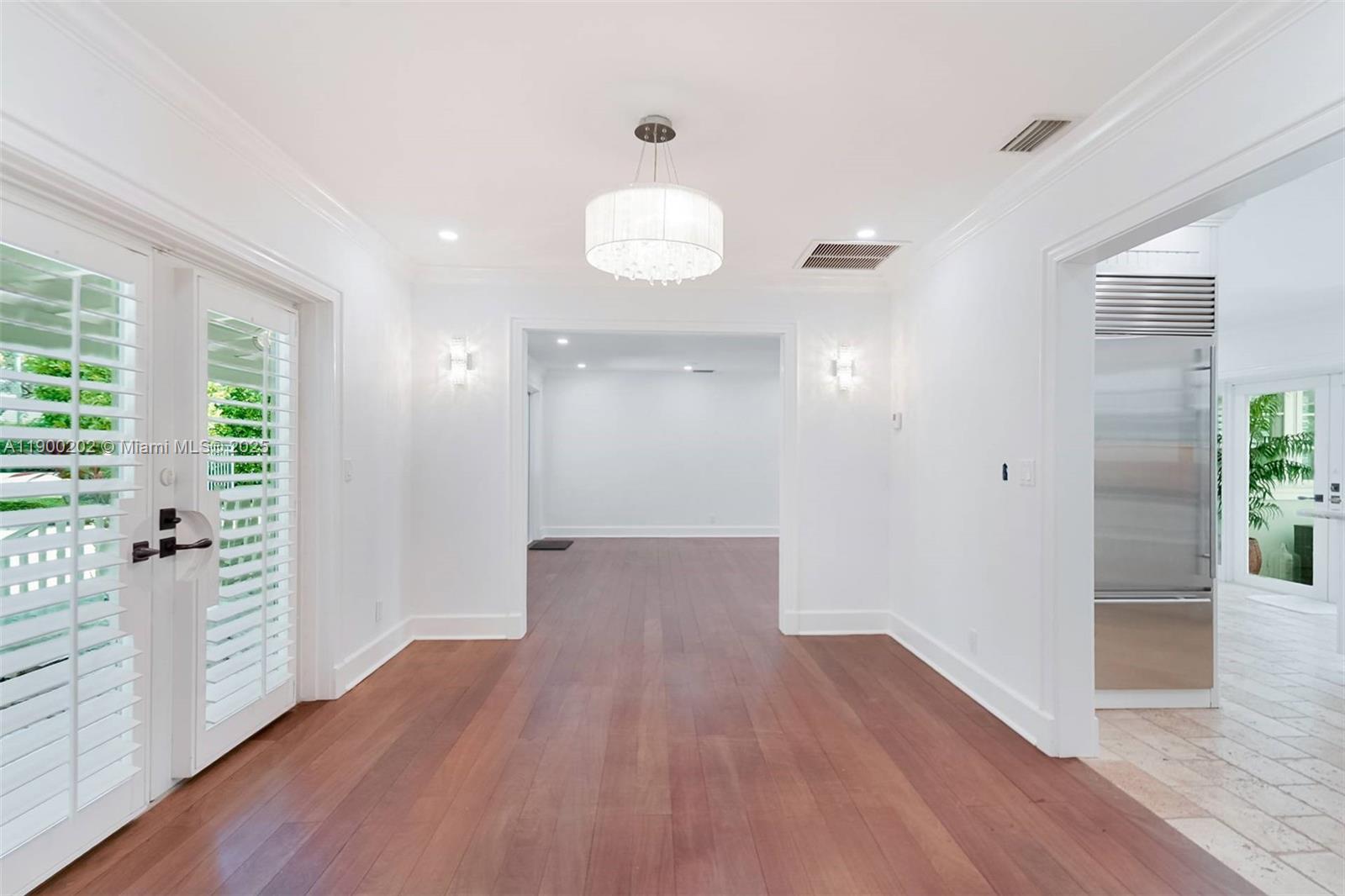 4920 Southwest 76th Street Miami, FL 33143 - Photo 20 of 36 wooden floor in an empty room with a window