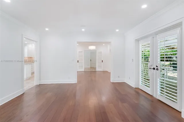 a kitchen with granite countertop a sink stove and cabinets