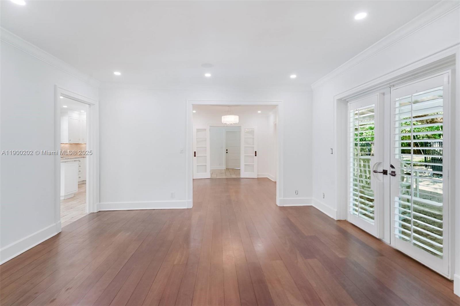 4920 Southwest 76th Street Miami, FL 33143 - Photo 21 of 36 a view of a big room with wooden floor and windows