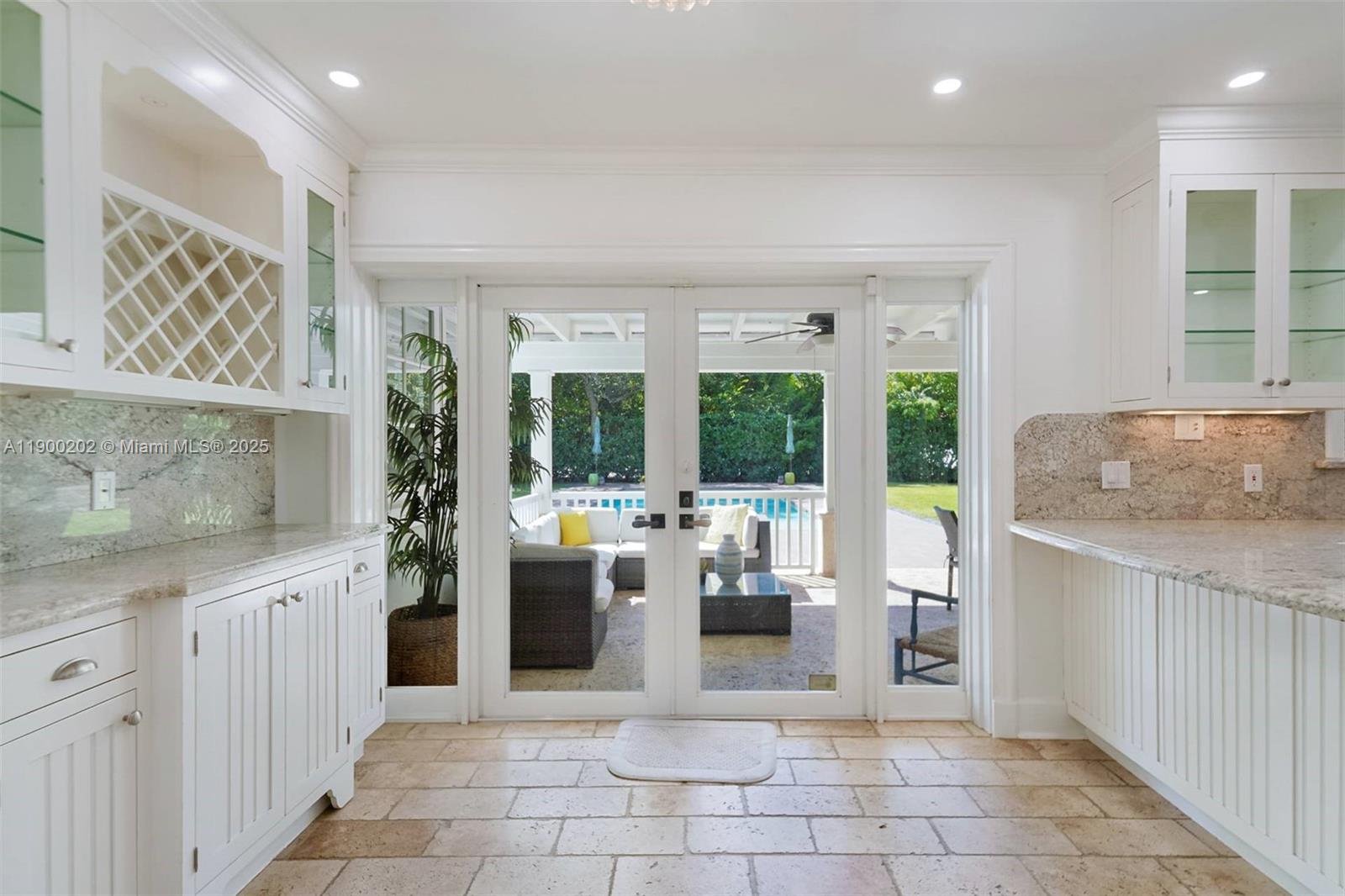 4920 Southwest 76th Street Miami, FL 33143 - Photo 23 of 36 a kitchen with stainless steel appliances granite countertop a sink and cabinets