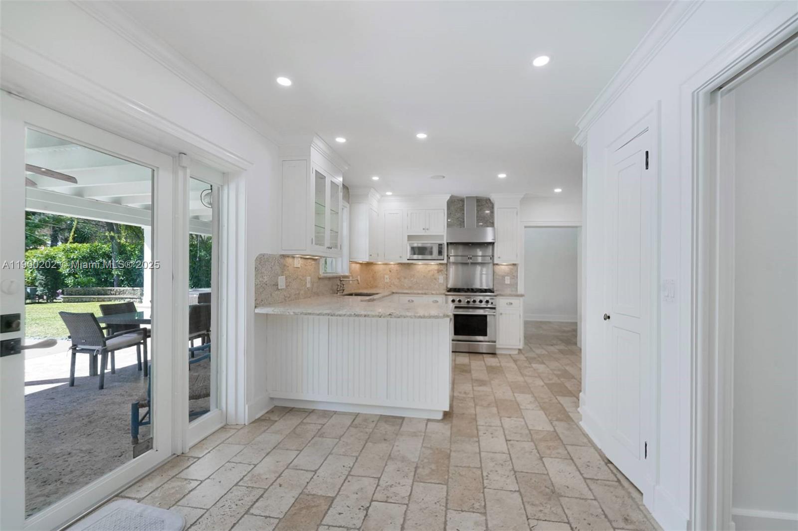 4920 Southwest 76th Street Miami, FL 33143 - Photo 25 of 36 a kitchen with stainless steel appliances granite countertop a refrigerator and a sink