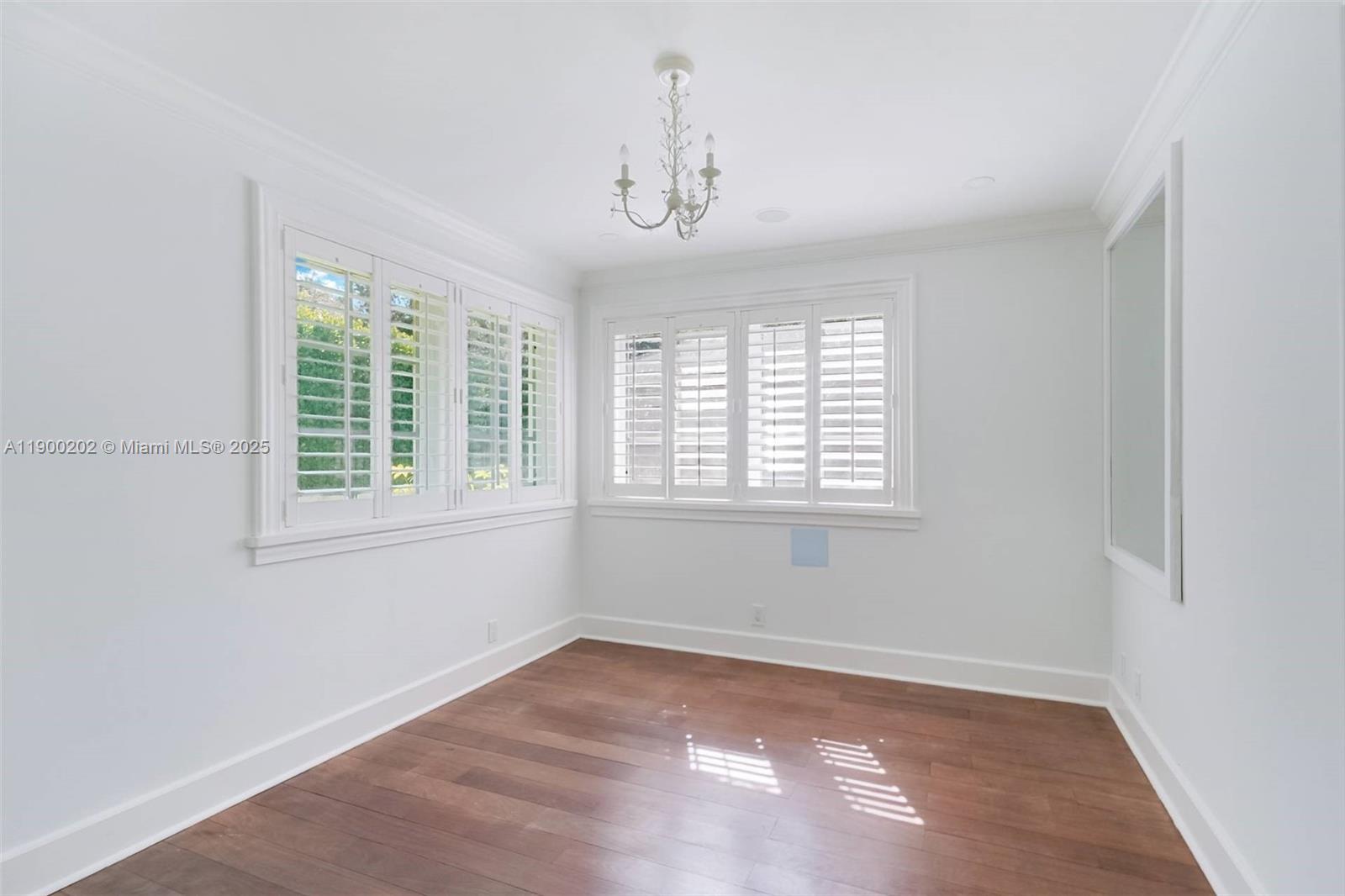 4920 Southwest 76th Street Miami, FL 33143 - Photo 29 of 36 wooden floor in an empty room with a window