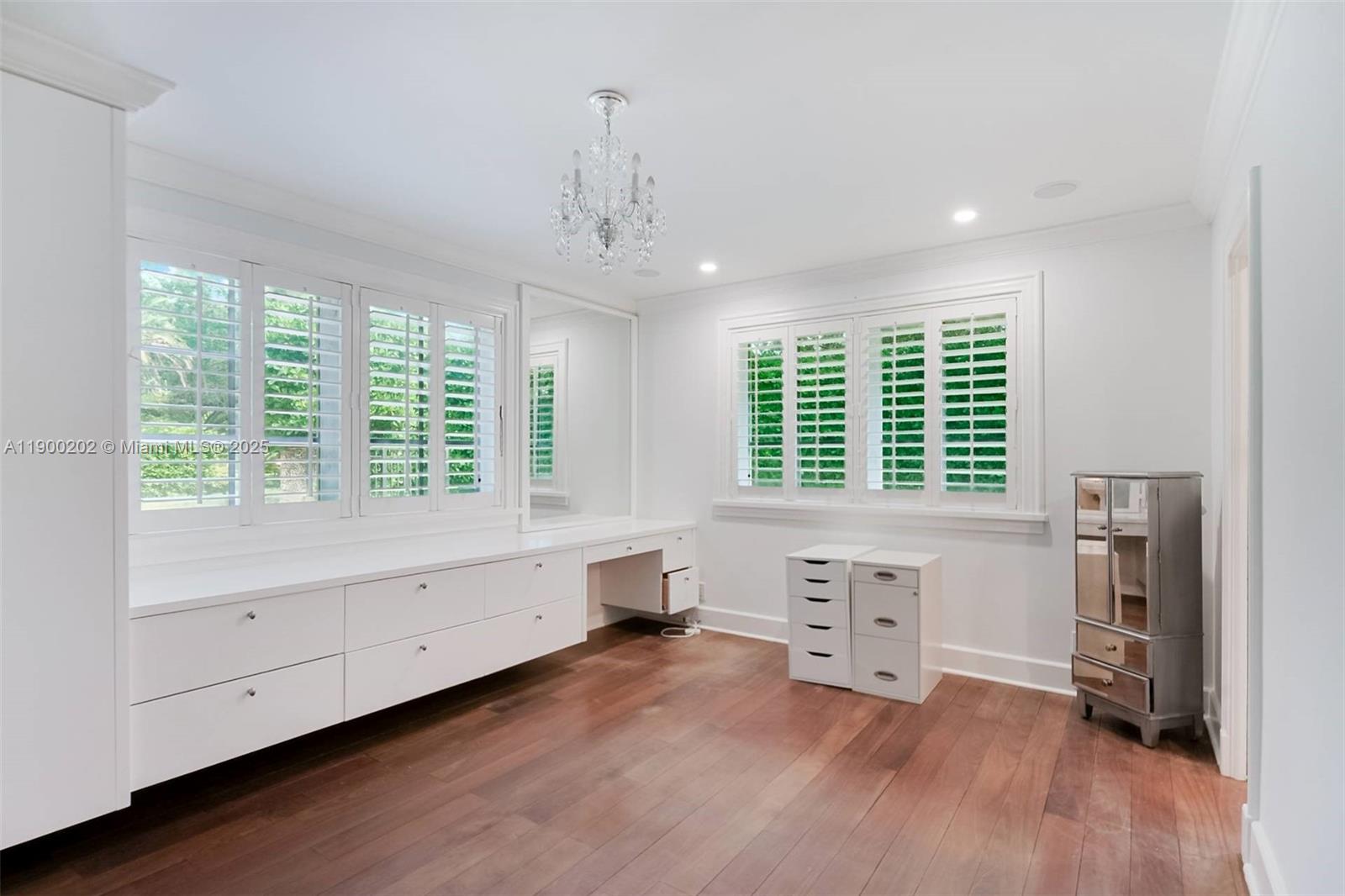 4920 Southwest 76th Street Miami, FL 33143 - Photo 30 of 36 a view of an empty room with a window and wooden floor