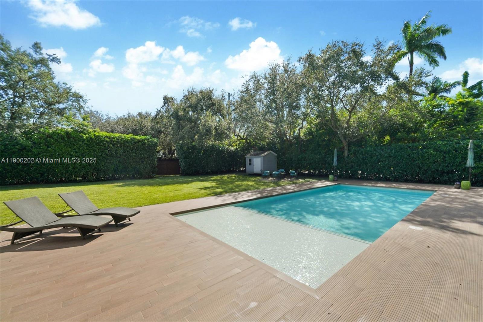 4920 Southwest 76th Street Miami, FL 33143 - Photo 7 of 36 a view of backyard with a bench and trees