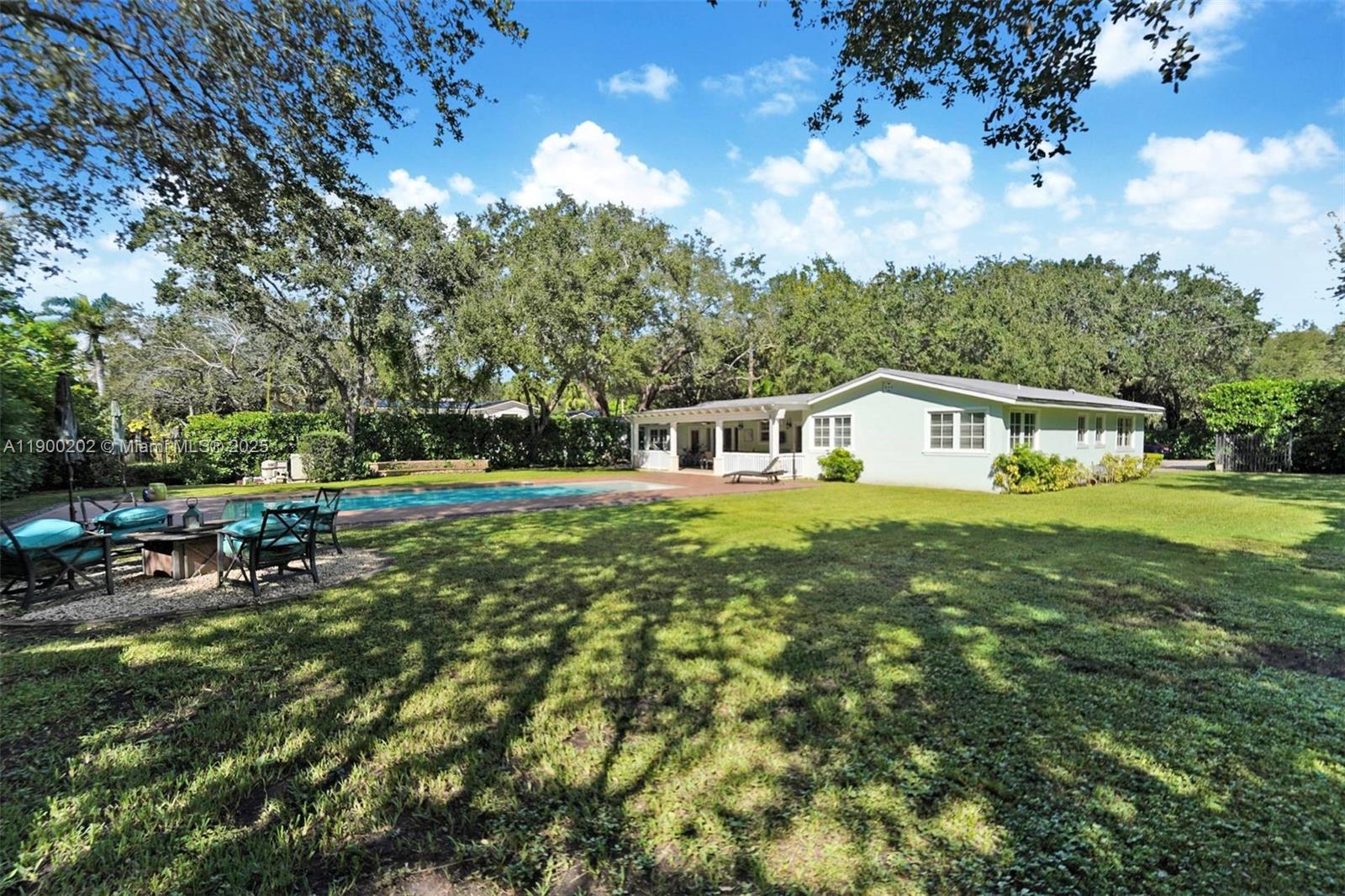 4920 Southwest 76th Street Miami, FL 33143 - Photo 8 of 36 a house view with a garden space