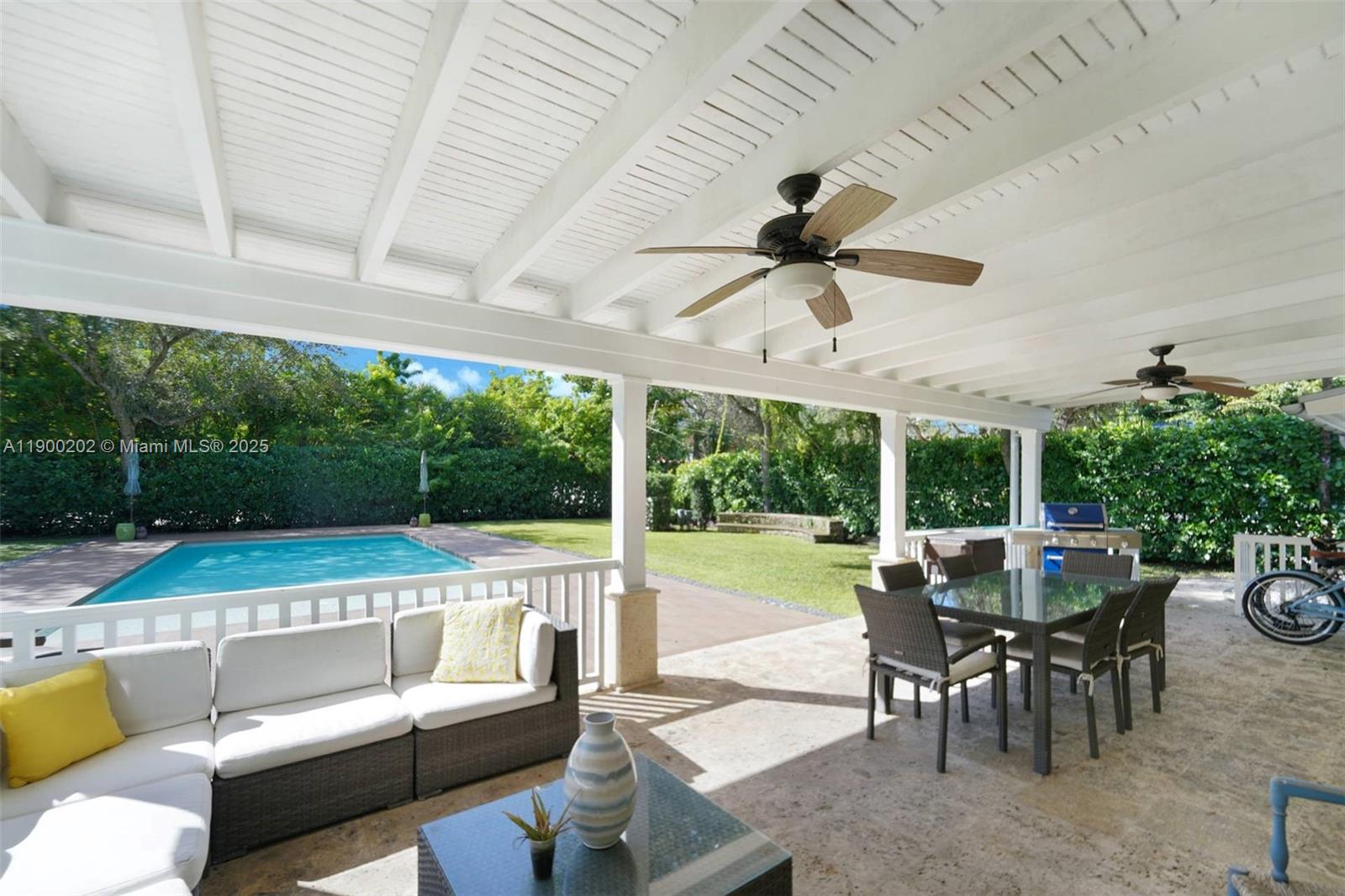 4920 Southwest 76th Street Miami, FL 33143 - Photo 10 of 36 a view of a patio with a dining table and chairs