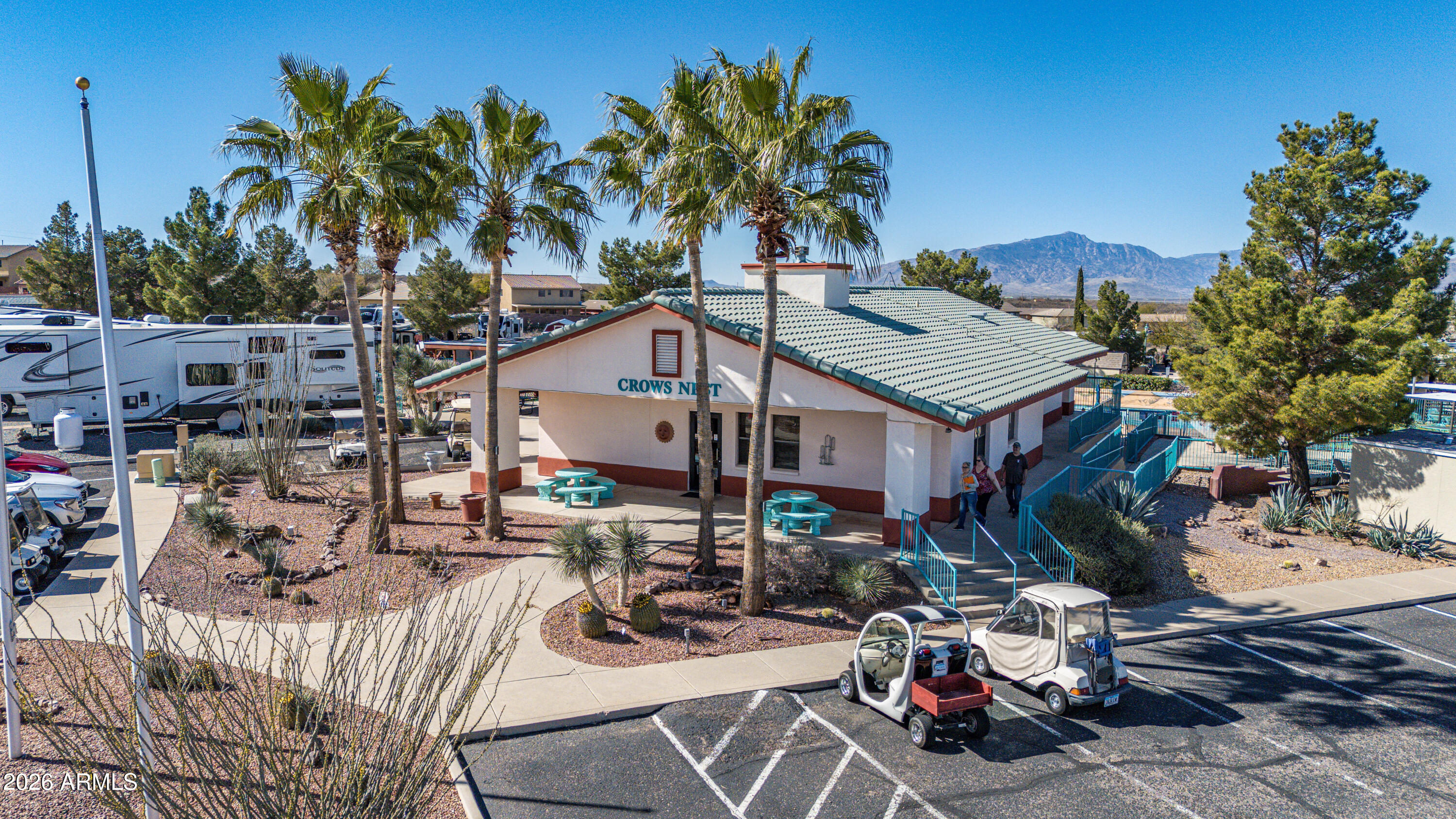 1030 Barrel Cactus Ridge, Unit 198 Benson, AZ 85602 - Photo 5 of 15 a view of a dinning table and chairs in patio