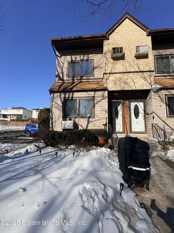 a front view of a house with parking space