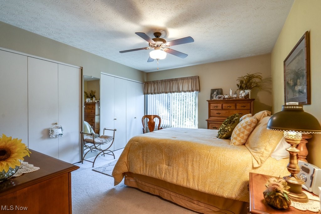 3404 South Smith Road Fairlawn, OH 44333 - Photo 17 of 37 The second Bedroom is spacious with large window, multi-closeted, and welcoming. Another ceiling fan with light. The bathroom is right next door.
