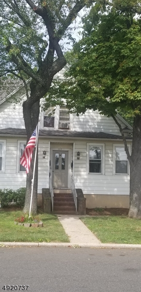 517 Woodlawn Avenue Linden, NJ 07036 - Photo 1 of 7 a front view of a house with a yard