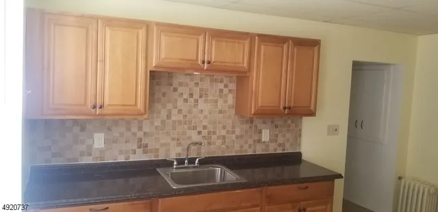 a bathroom with a toilet a sink and bathtub
