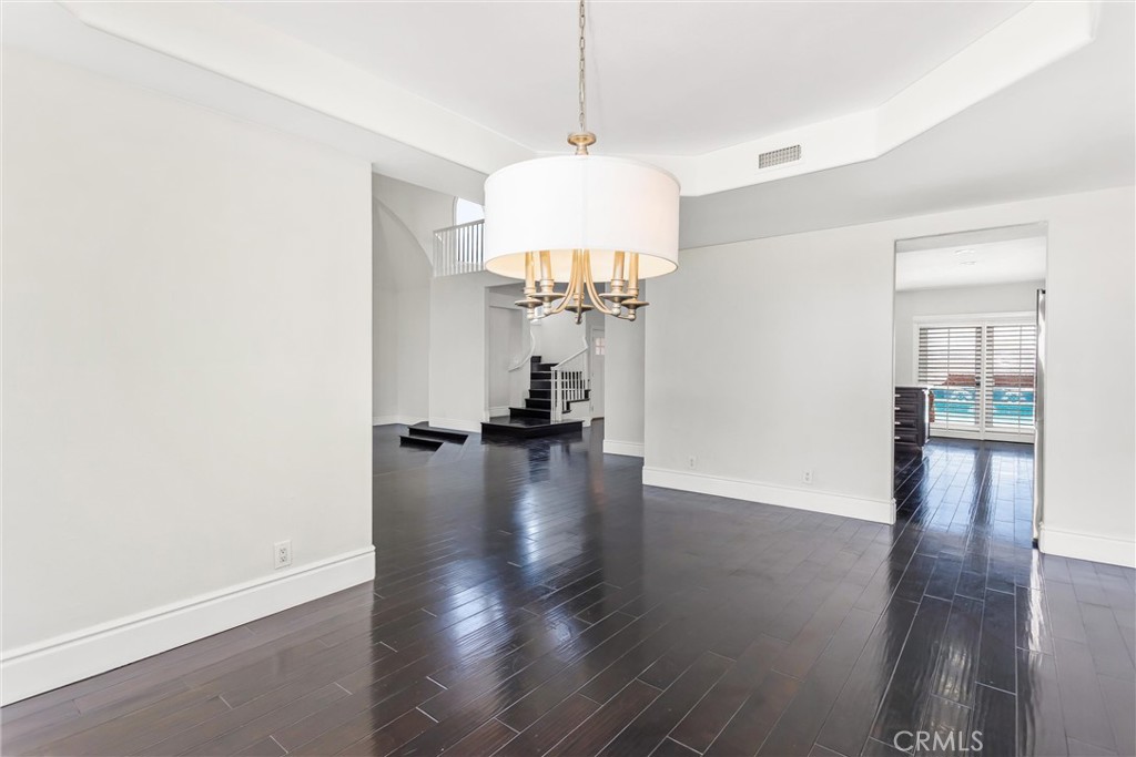 1608 Smiley Ridge Redlands, CA 92373 - Photo 20 of 84 a view of a room with wooden floor staircase and a kitchen