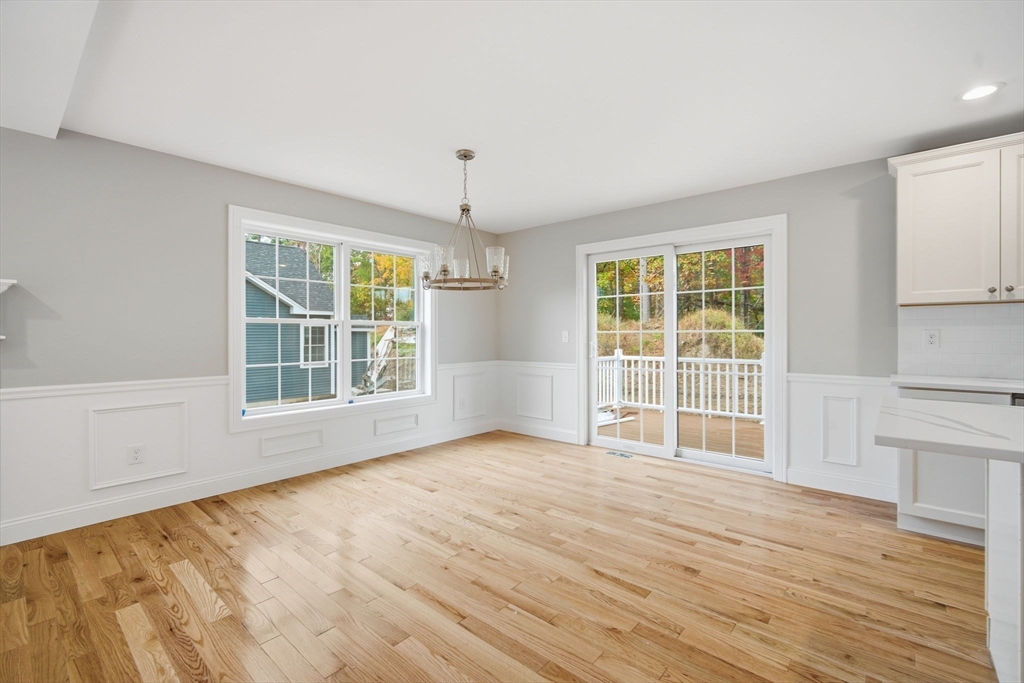 23 High Blf Road Belchertown, MA 01007 - Photo 12 of 39 an empty room with wooden floor and windows