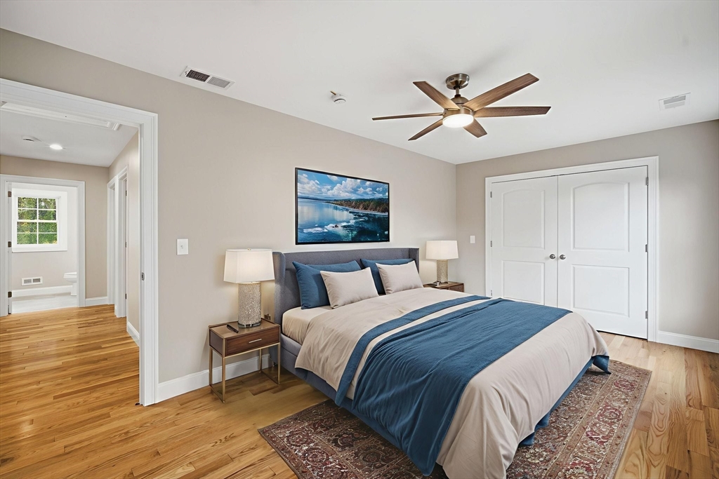 23 High Blf Road Belchertown, MA 01007 - Photo 17 of 39 a spacious bedroom with a bed and a ceiling fan