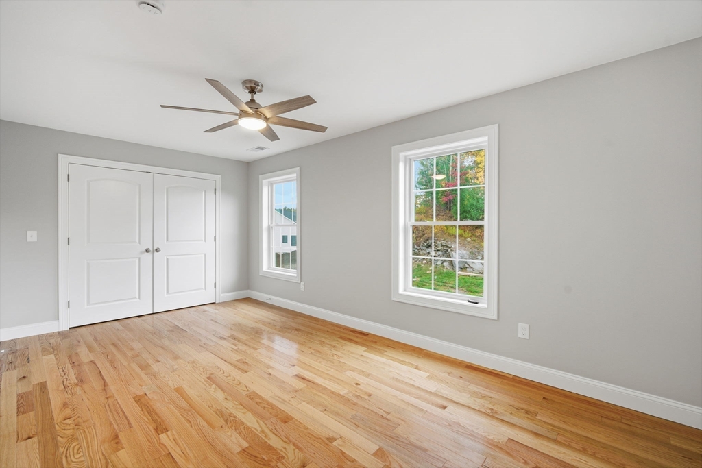 23 High Blf Road Belchertown, MA 01007 - Photo 19 of 39 a view of an empty room with window and a kitchen