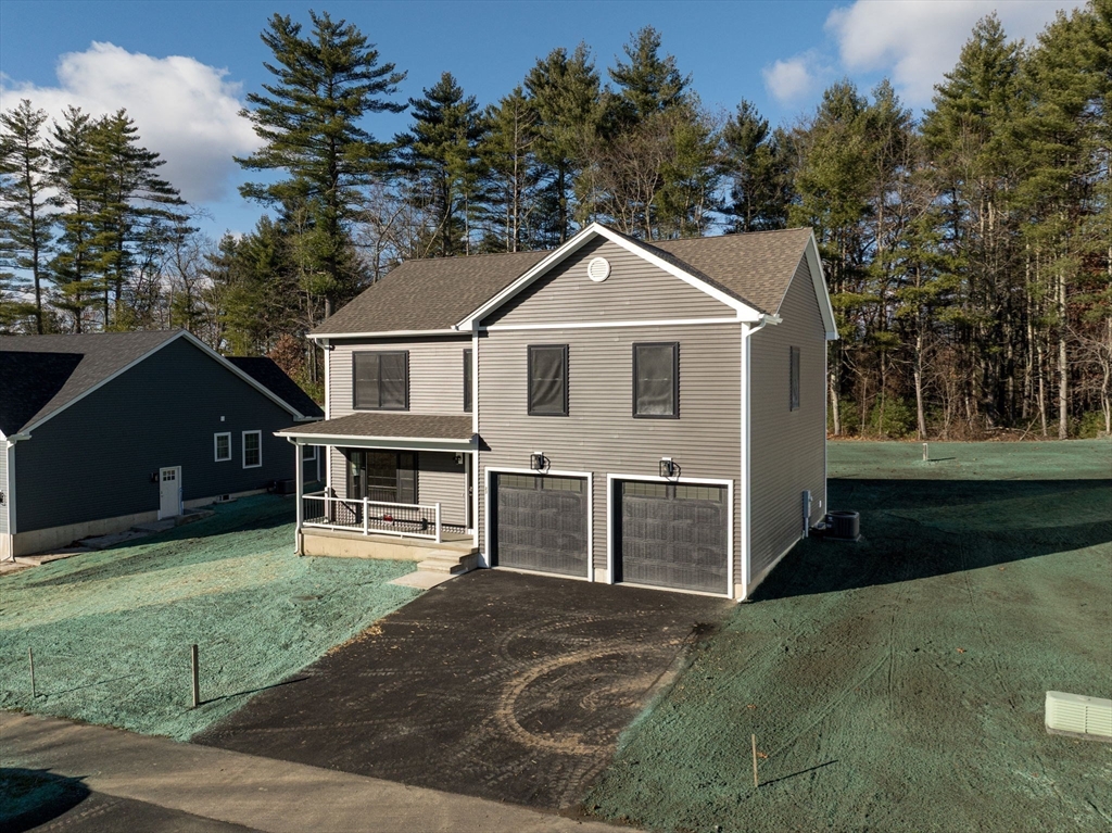 23 High Blf Road Belchertown, MA 01007 - Photo 2 of 39 front view of a house with a yard