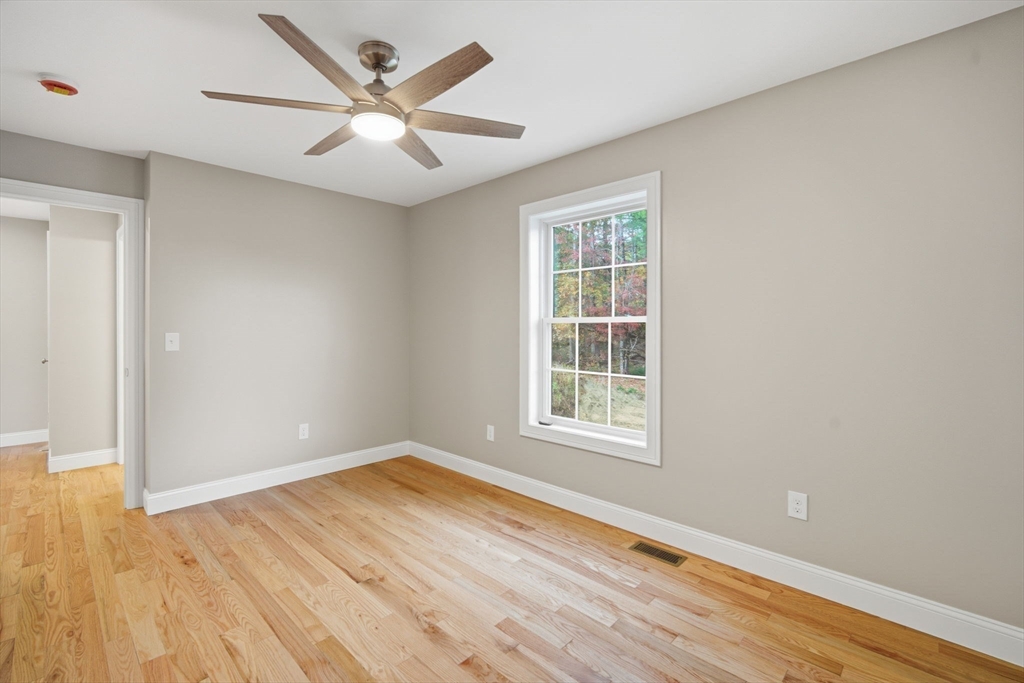 23 High Blf Road Belchertown, MA 01007 - Photo 24 of 39 an empty room with wooden floor and windows