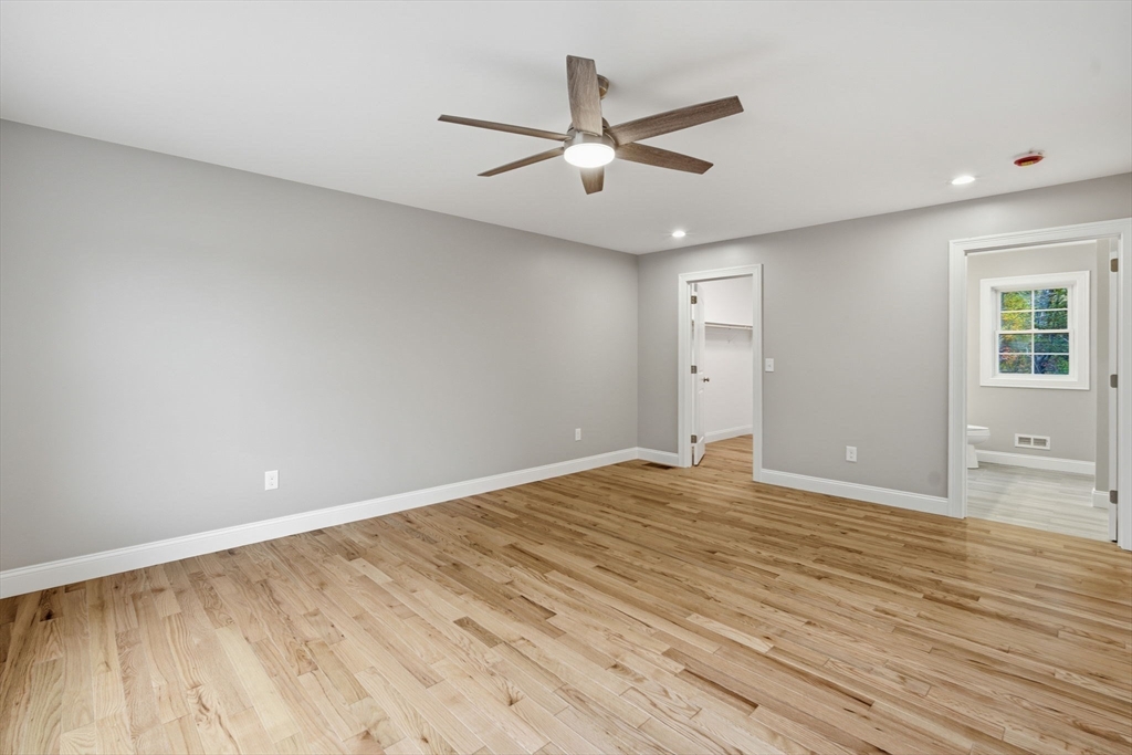 23 High Blf Road Belchertown, MA 01007 - Photo 27 of 39 an empty room with wooden floor and windows