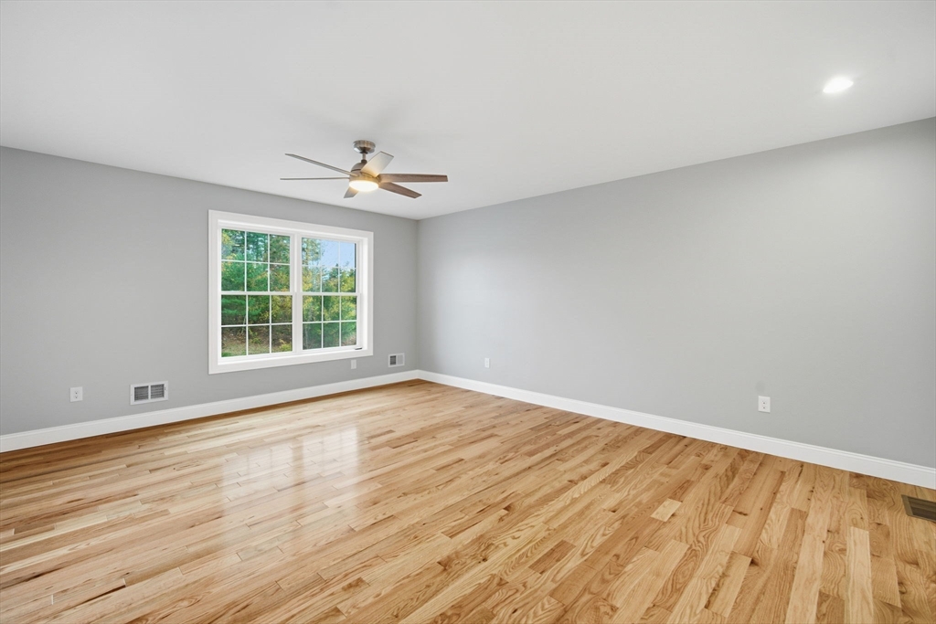 23 High Blf Road Belchertown, MA 01007 - Photo 33 of 39 wooden floor in an empty room with a window