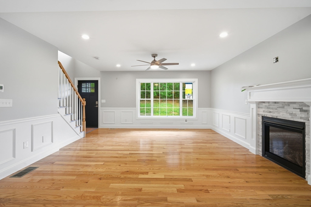 23 High Blf Road Belchertown, MA 01007 - Photo 9 of 39 a view of an empty room with a fireplace and a window
