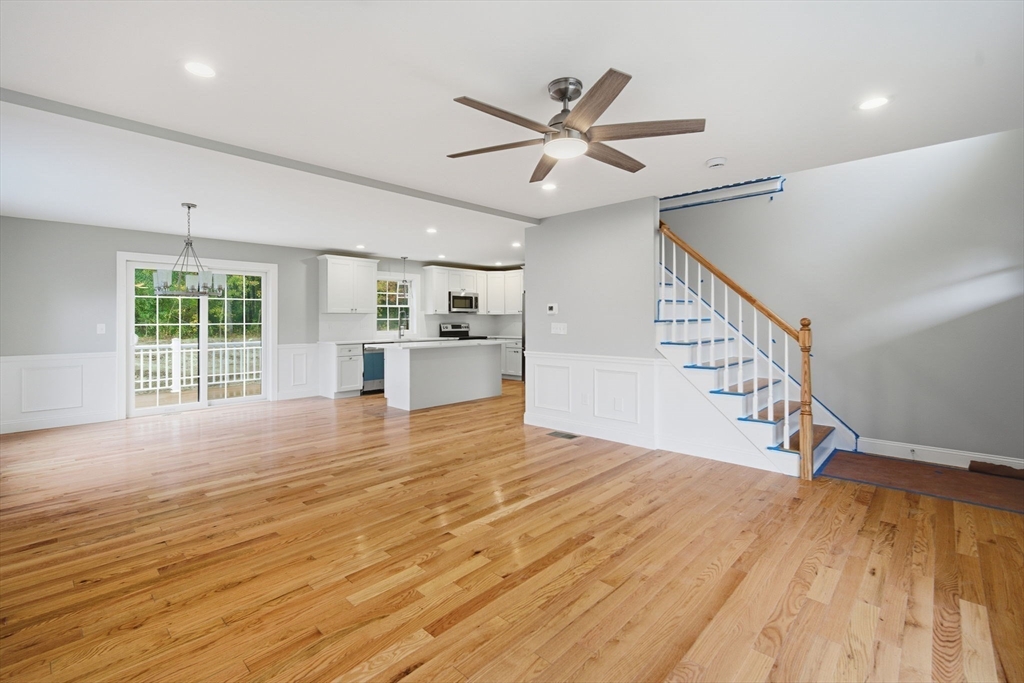 23 High Blf Road Belchertown, MA 01007 - Photo 10 of 39 a view of empty room with wooden floor and fan