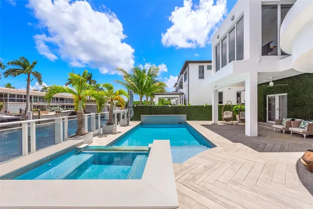 a bathroom with a bathtub and potted plant
