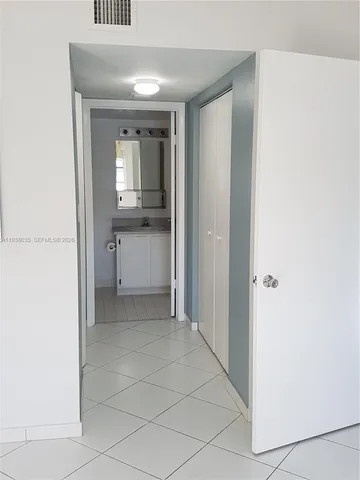 a view of a bathroom from the hallway