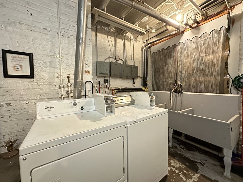 3832 North Fremont Street, Unit G Chicago, IL 60613 - Photo 20 of 20 a bathroom with a sink and a mirror